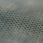 A close up view of a gray fabric